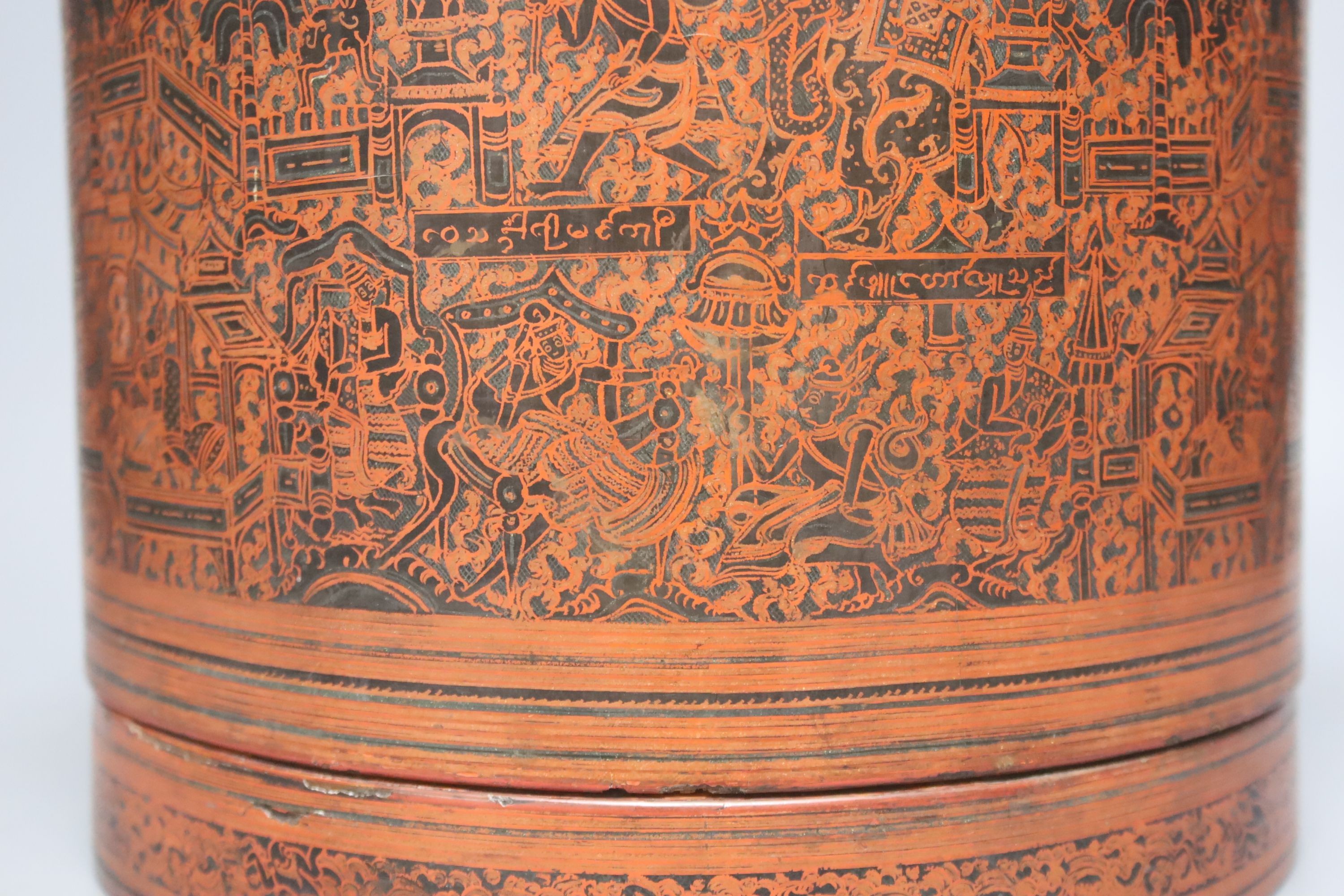 A large Burmese red and black lacquer betel box and cover with internal tray, late 19th century, 22cm